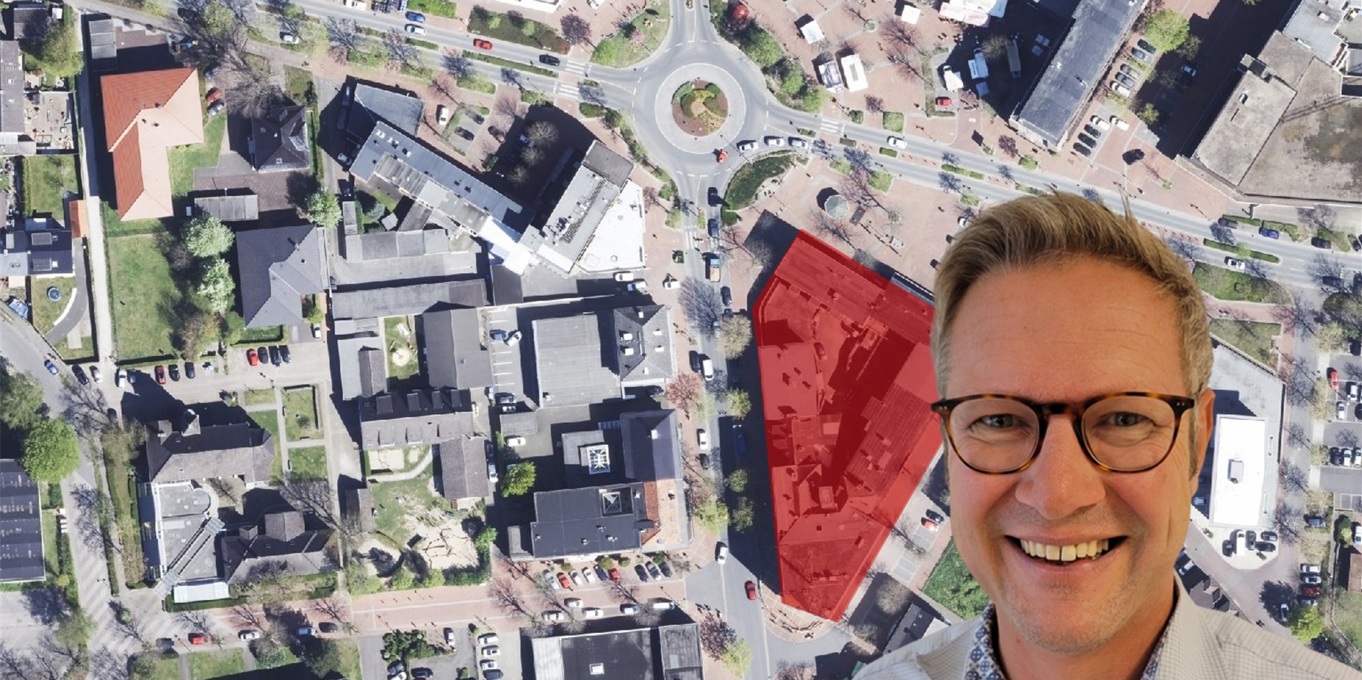Ein Mann vor einem Luftbild der City
