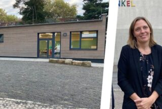 Ein Schulgebäude und eine Frau