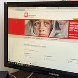 Bildschirm zeigte Website von Caritasverband Ostvest