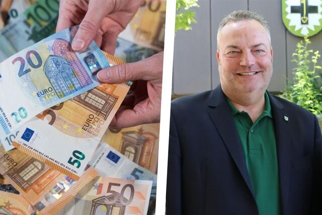Landrat Bodo Klimpel neben einem Haufen von Geldscheinen