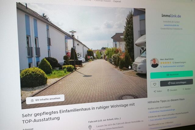 Bildschirm mit Immobilien-Exposé.