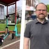 Links stehen mintgrüne E-Roller unterhalb einer Bushaltestelle, rechts ein Mann mit grauem Poloshirt, Bart und Brille.