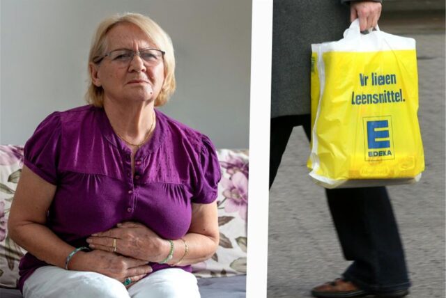 Frau mit Magenschmerzen und Edeka Tüte