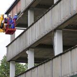 Arbeiter an der Fassade des früheren Amaro-Hauses