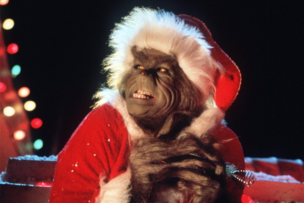 Der hinterlistige Grinch (Jim Carrey) reibt sich in dem Weihnachtsfilm Der hinterlistige Grinch (Jim Carrey) reibt sich in dem Weihnachtsfilm