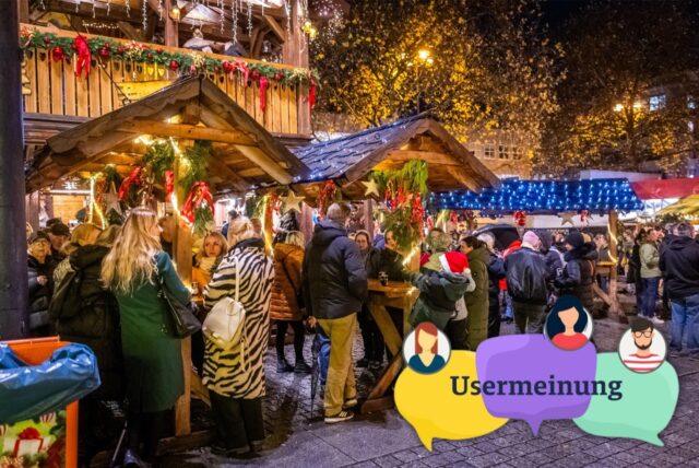 Auf dem Dortmunder Weihnachtsmarkt stehen viele Menschen an Stehtischen.
