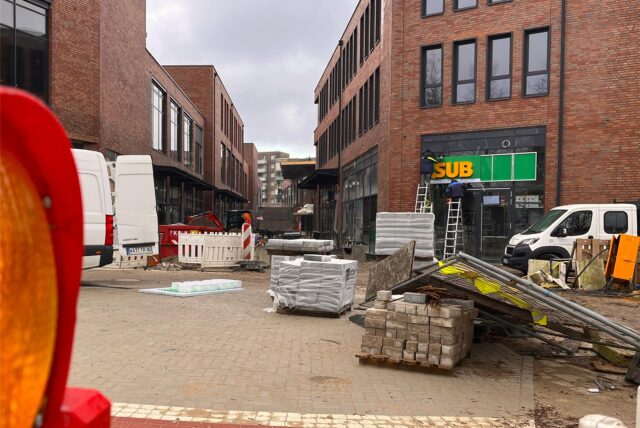 Blick in die neue Einkaufsgasse zwischen den Gebäudeblöcken der Hertener Höfe.