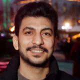 Hisham Hawari, ein junger Mann mit dunklen Haaren und Bart.