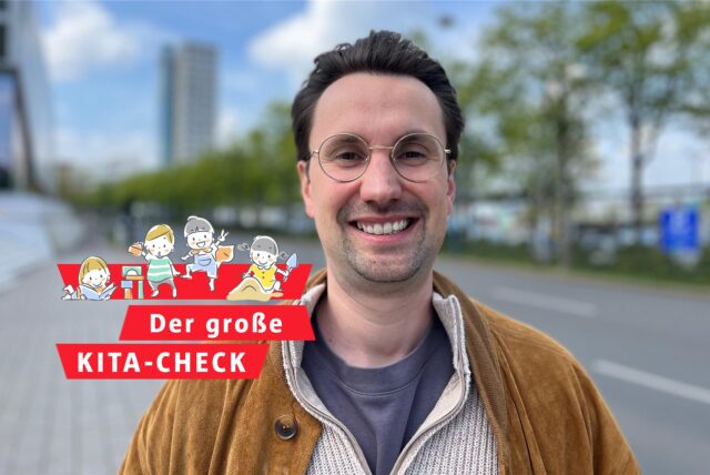 Ein Vater lächelt in die Kamera – im Hintergrund unscharf zu erkennen: die Bäume am Wall in Dortmund.