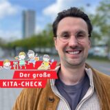 Ein Vater lächelt in die Kamera – im Hintergrund unscharf zu erkennen: die Bäume am Wall in Dortmund.