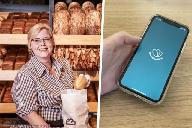 Eine Hand hält ein Mobiltelefon mit dem Logo der App „Too Good To Go“ vor einem Hintergrund von Zitronen. Die App zielt darauf ab, Lebensmittelverschwendung zu reduzieren, indem sie Nutzern ermöglicht, überschüssige Lebensmittel zu reduzierten Preisen von Restaurants und Geschäften zu erwerben.