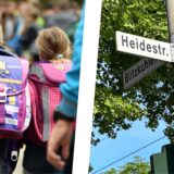 Links drei Schulkinder mit Tornistern von hinten, rechts ein Straßenschild der Heidestraße in Recklinghausen